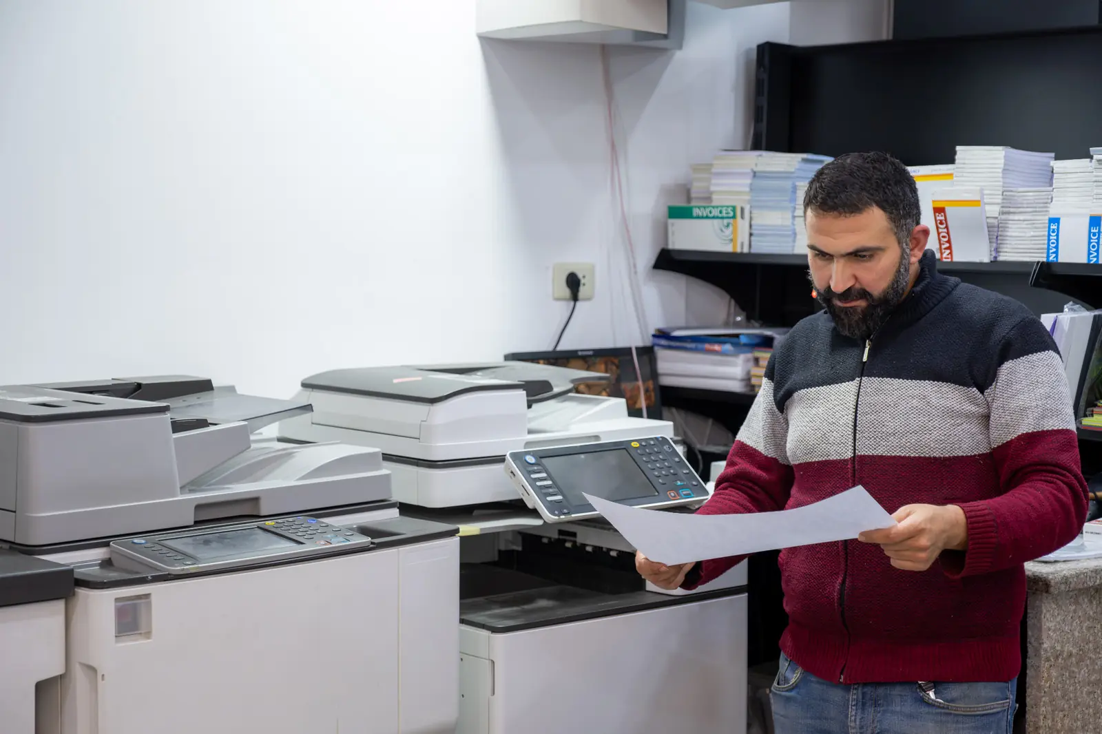 Professional working with a multifunction printer