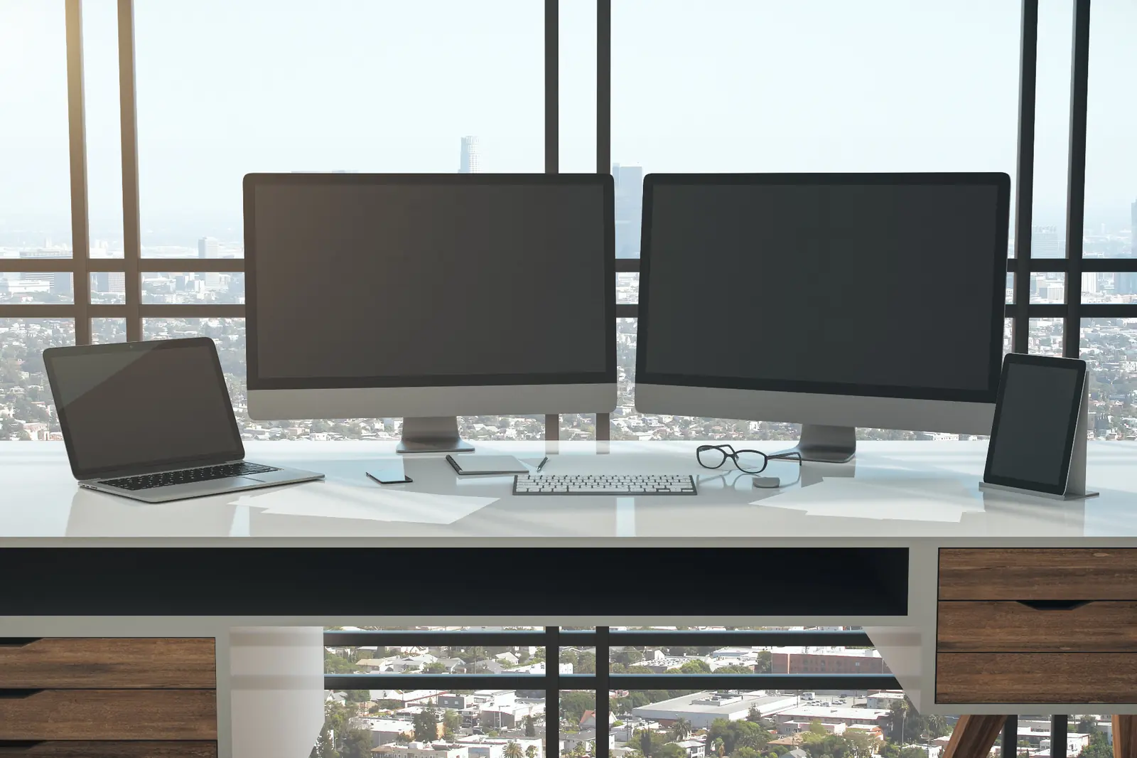 Business professionals using computers in a modern office