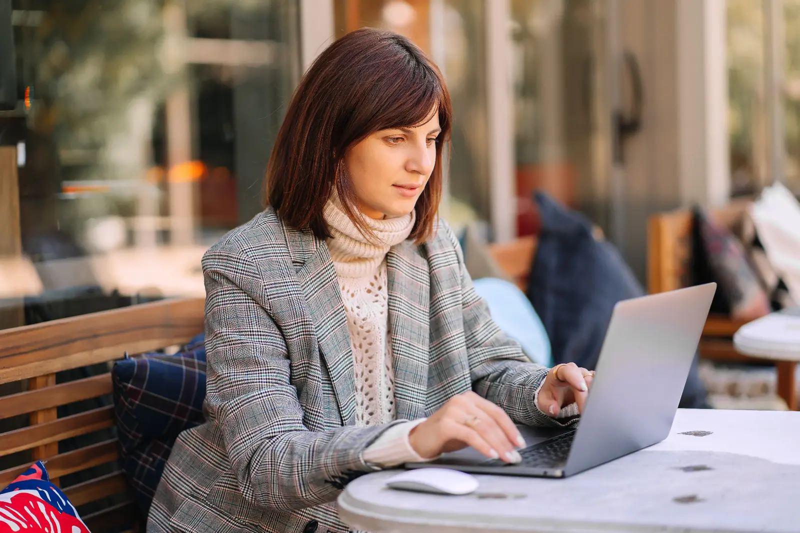 Professionals using laptop computers in a modern office