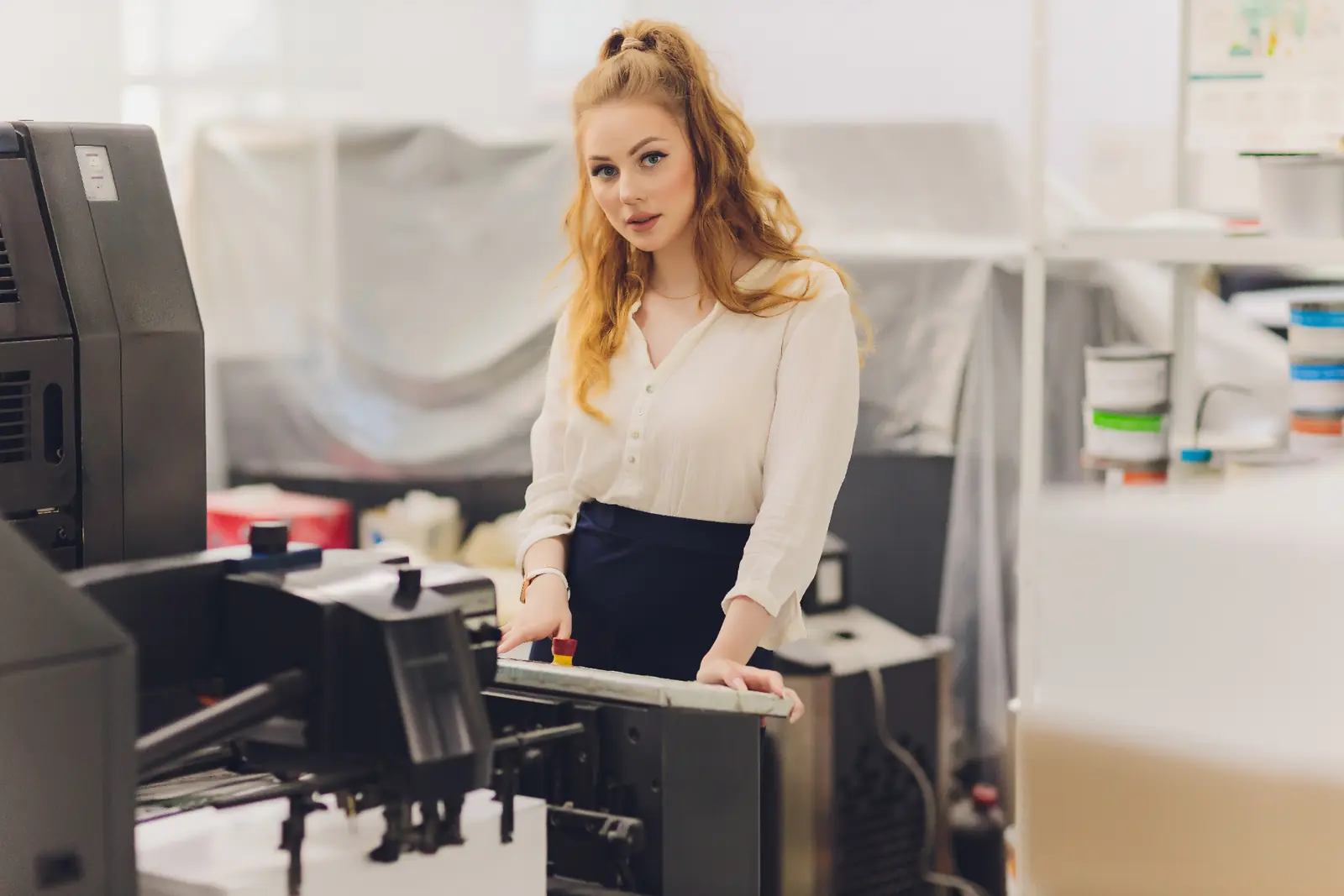 Professional working with a multifunction printer in an office