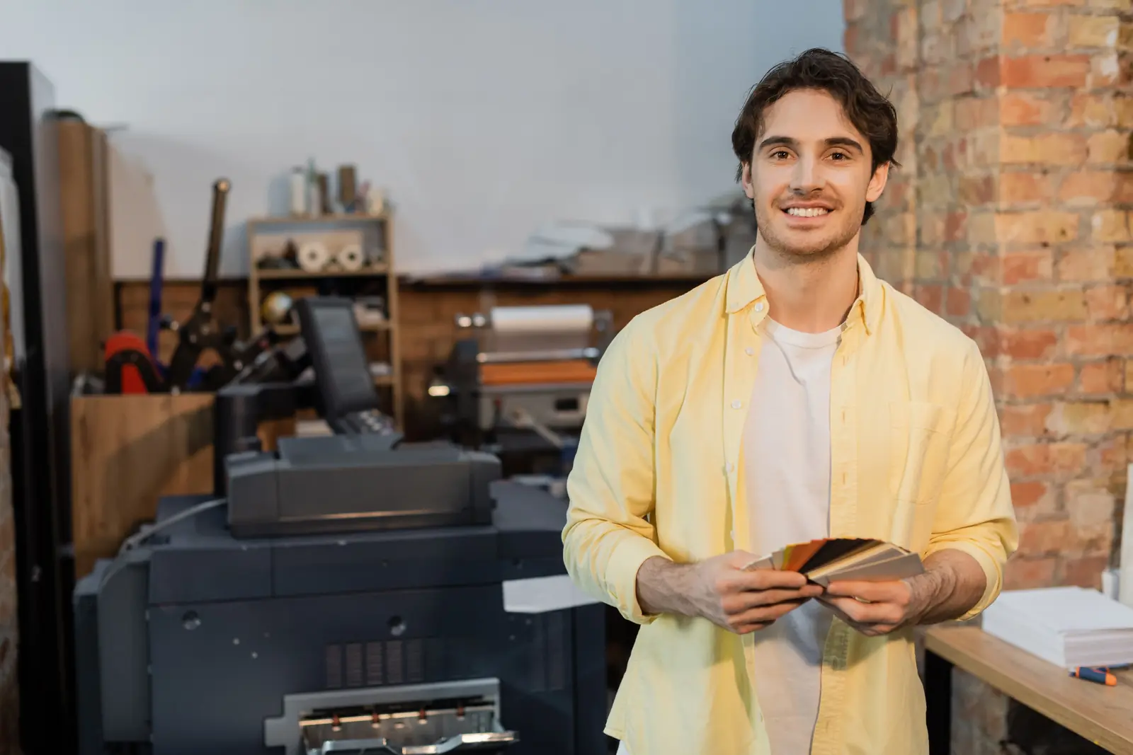 Professional working with a multifunction printer in an office